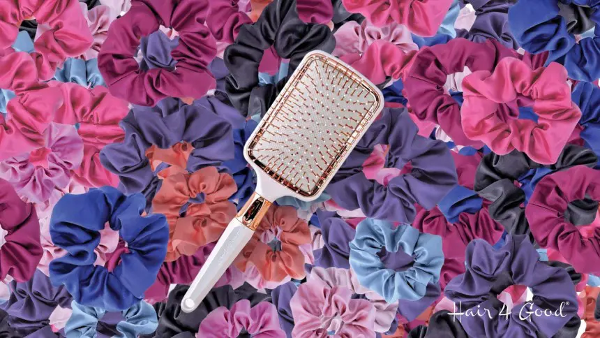 A hair brush sitting on top of a bunch of flowers.