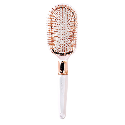 A white and gold comb with a pink handle.